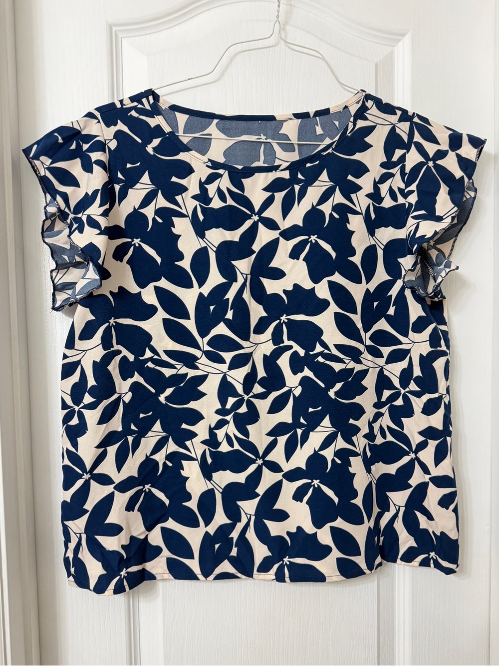 Navy blue and cream floral blouse ruffle flutter short sleeves size L